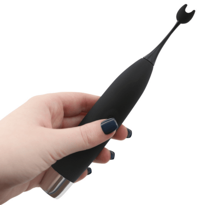 Image of hand holding silicone clit stimulator 