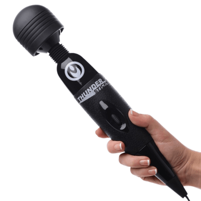 Image of a person's hand holding the Master Series Thunder Stick Power Wand.