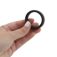 Image of the cock ring being held in hand.