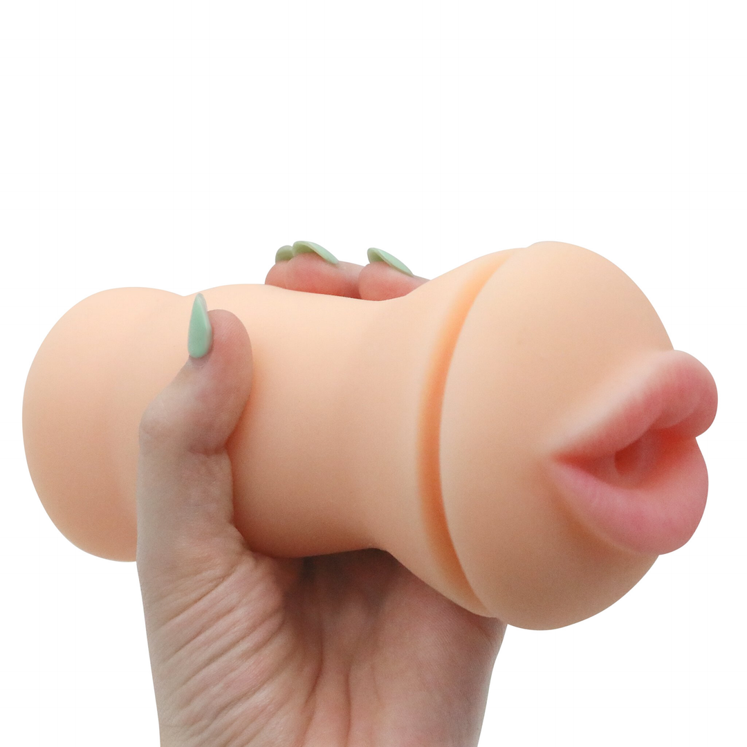 Image of of the masturbator in hand. This compact toy features a sexy mouth opening that both looks and feels like the real thing. It also will warm to your body temperature as you continuously thrust it in and out of you. Spice up your solo play today with this ultra-realistic masturbator! 