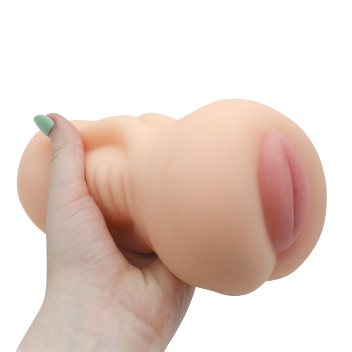 Image of the masturbator in hand. This compact pussy stroker will stimulate your cock with every thrust, leading to mind-blowing orgasms! Try this pussy stroker out today and enhance your solo play!