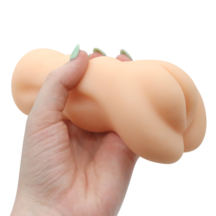 Image of the masturbator in hand. This compact toy allows you to easily vary your grip to go as fast or as slow as you want! Spice up your next masturbation session today with this tight and real-feel pocket pussy! 