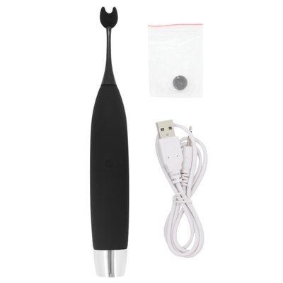 Image of clit vibrator with silicone attachment in protective bag and USB rechargeable cord
