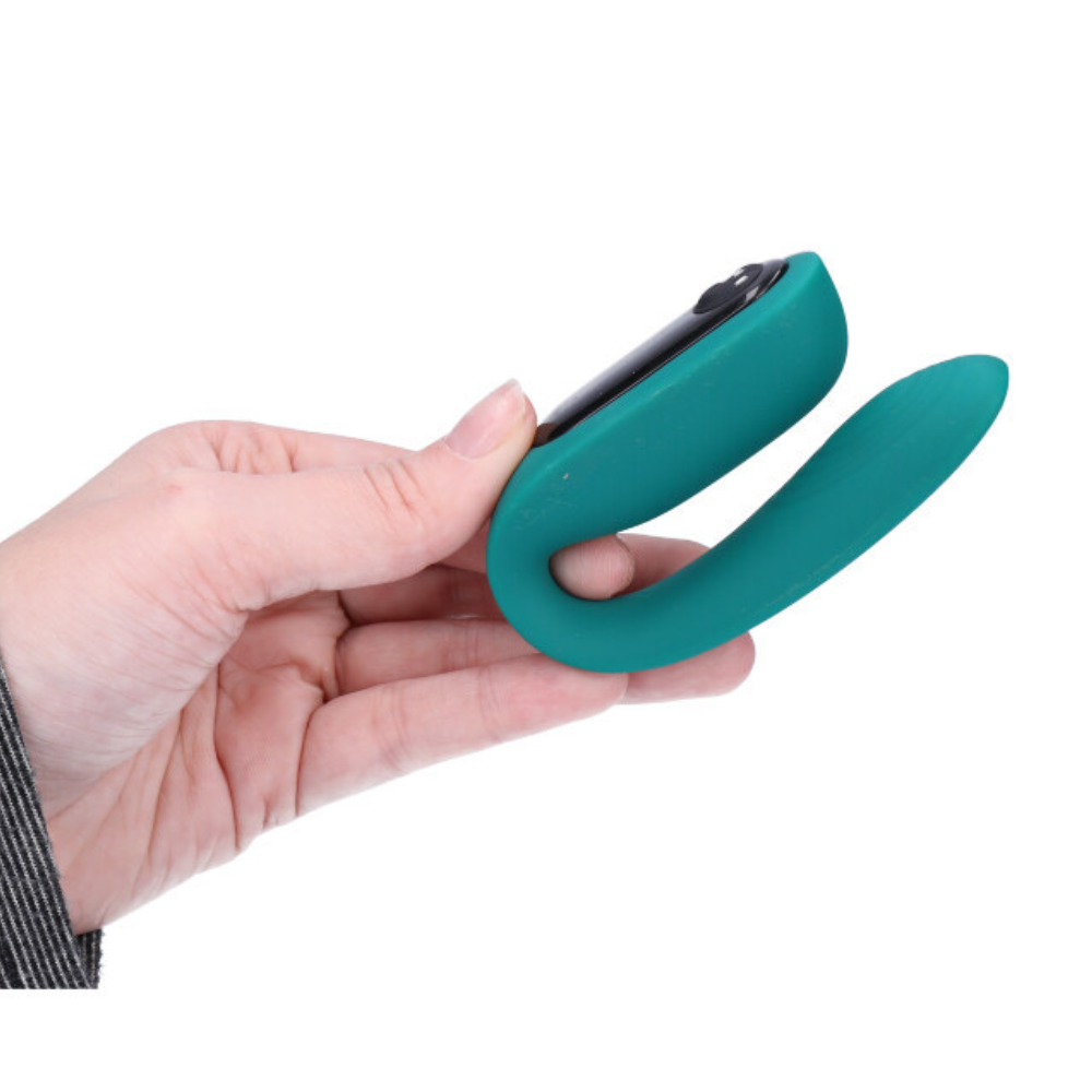 Image of the couples vibrator held in hand.