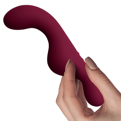 Image of hand holding the vibrator from the side.
