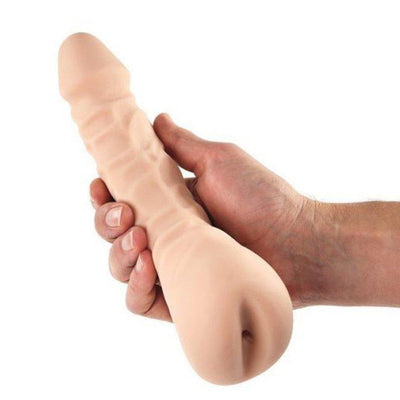 Hand shown holding realistic mangina sex toy