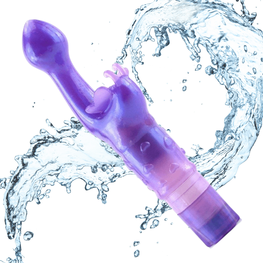 Image of the purple butterfly kiss with water splashing behind it.