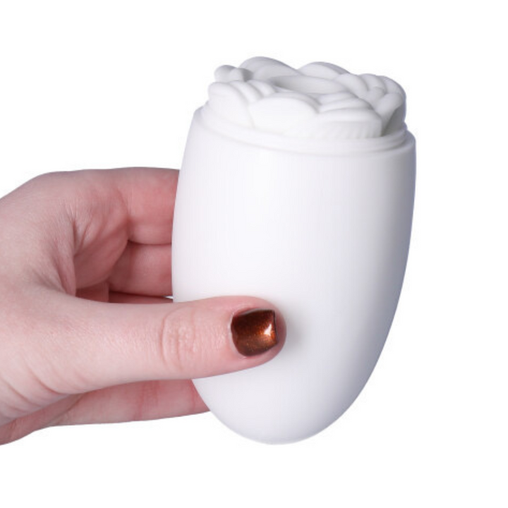 Picture of the rose masturbator with the case being held in hand.