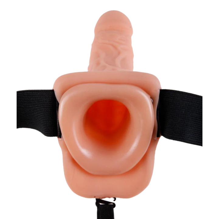 Hollow strap-on dildo in beige showing entrance for the user's penis