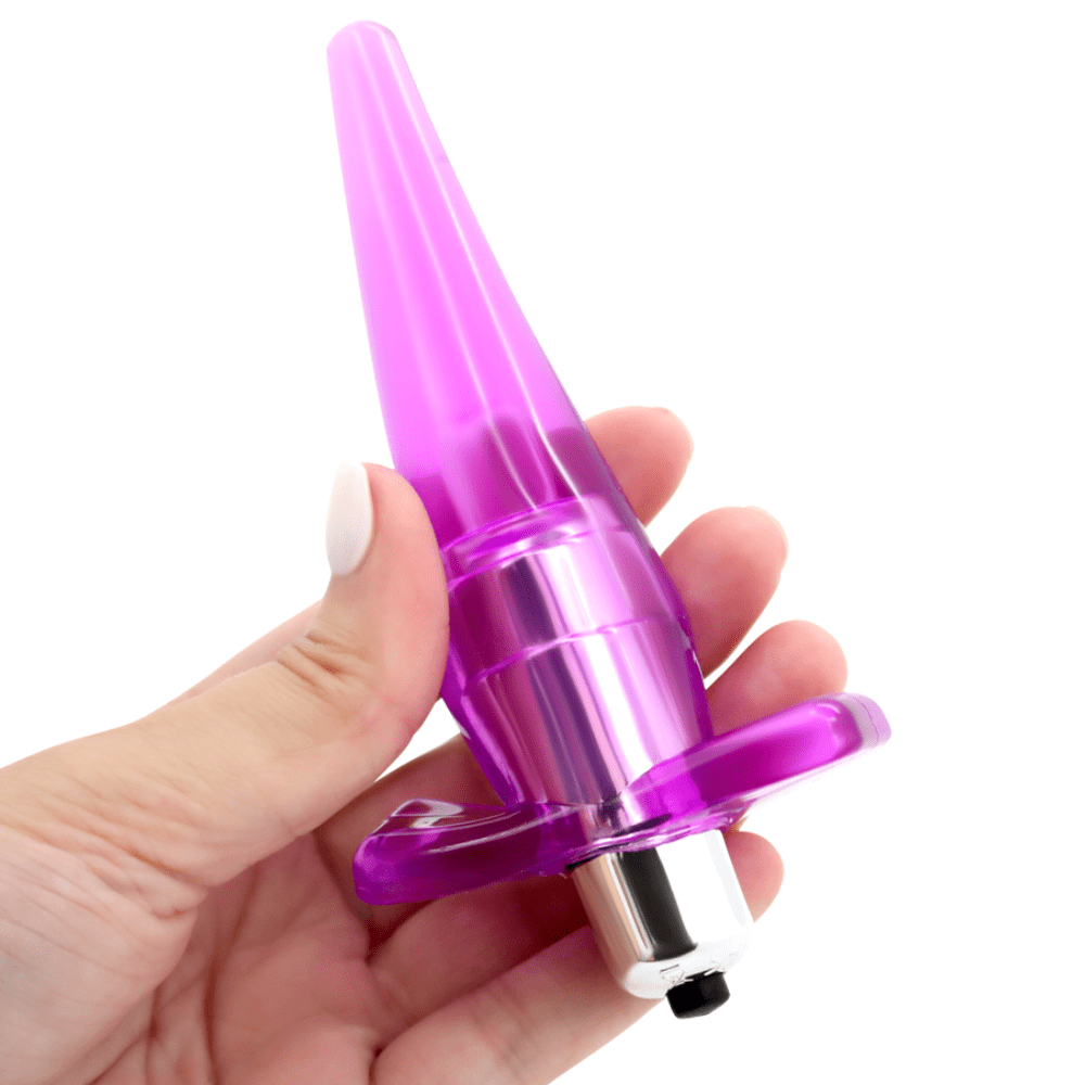 Image of hand holding the purple butt plug.