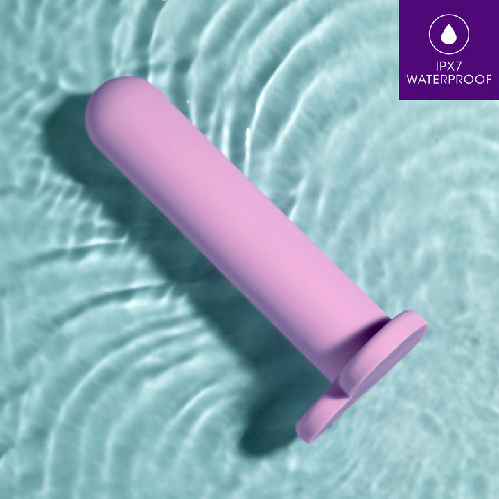 Blush Novelties pink anal dilator with a light blue water background 