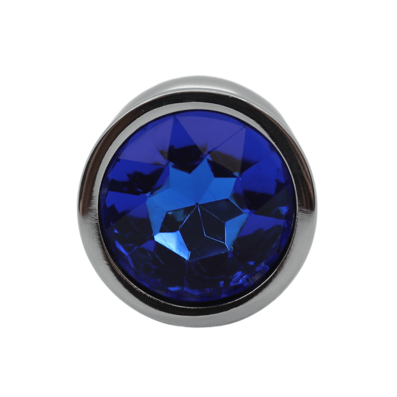 Close-up image of the blue jewel on the anal plug.