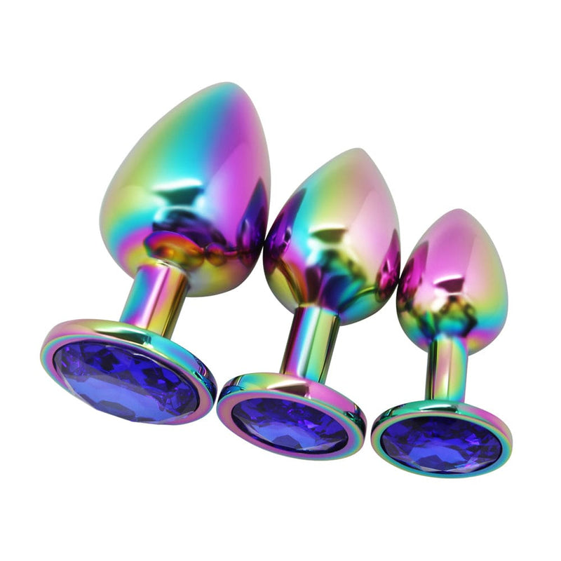 Image of rainbow butt plugs with blue jewel in all three size options - small, medium, and large