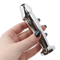 Image of hand holding metal penis-shape anal plug