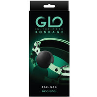 Image of the packaging for the Glow In The Dark Bondage Ball Gag. Text reads Glo in the dark bondage ball gag, NS novelties.