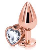 Image of the Rainbow Heart Jeweled Metal Butt Plug in rose gold with a clear jeweled base