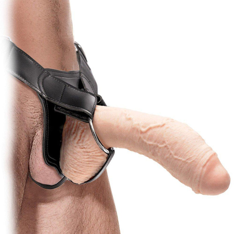 Male model shown wearing hollow dildo with sex harness