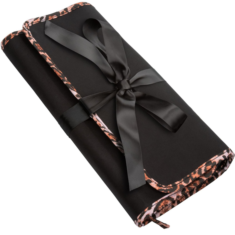 Image of the travel case with a bow on top. No one will know what is inside of this discreet travel case! Spice things up while you travel with this on the go bondage kit!