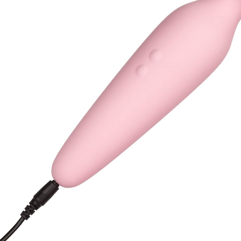 Image of the massager charging cord plugged into the device. This rechargeable device is perfect for those who do not want to corry about a charging cord or batteries!