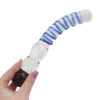 Image of the glass dildo being held in hand.