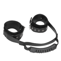 Image displays leather handcuffs with handle.