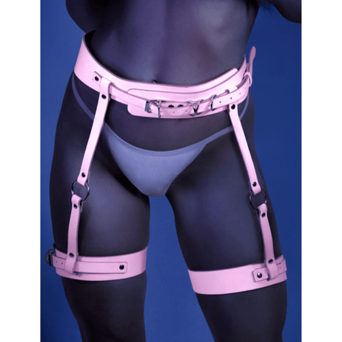 Image displays model wearing a pink strapped in glow-in-the-dark leg harness.