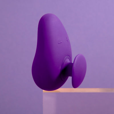 Blush Novelties purple palm adult sex toy vibrator with a purple background on TooTimid