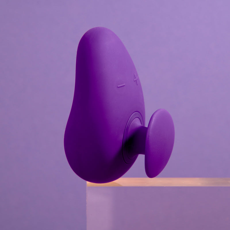Blush Novelties purple palm adult sex toy vibrator with a purple background on TooTimid