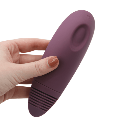 Image of hand holding the toy.