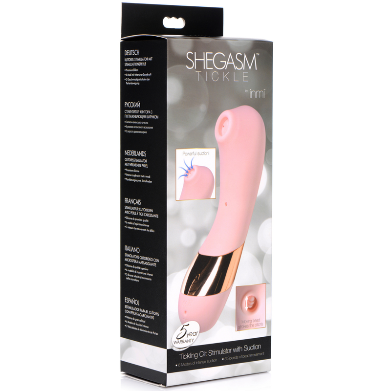 Image of the packaging for the Shegasm Tickle Clit Stimulator. Text reads Shegasm Tickle by inmi, powerful suction, moving bead strokes the clitoris, 5 year warranty, tickling clit stimulator with suction, 6 modes of intense suction, 3 speeds of bead movement