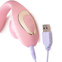 Image of Bendable 2-in-1 Flickering Clit and G-Spot Vibrator showing a close up of the separate power buttons for the flickering tongue and internal vibrations, and the charging port with included USB charging cable.