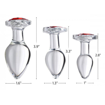 Image showing the dimensions of the three sizes of the Booty Sparks Red Heart Gem Glass Anal Plug. The small plug measures 1 inch by 2.8 inches, the medium plug measures 1.3 inches by 3.3 inches, the large plug measures 1.6 inches by 3.9 inches.
