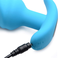 Image of the charging cable plugged into the anal toy.
