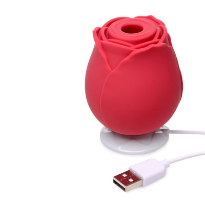 photo of the rose sex toy next to the magnetic charging stand
