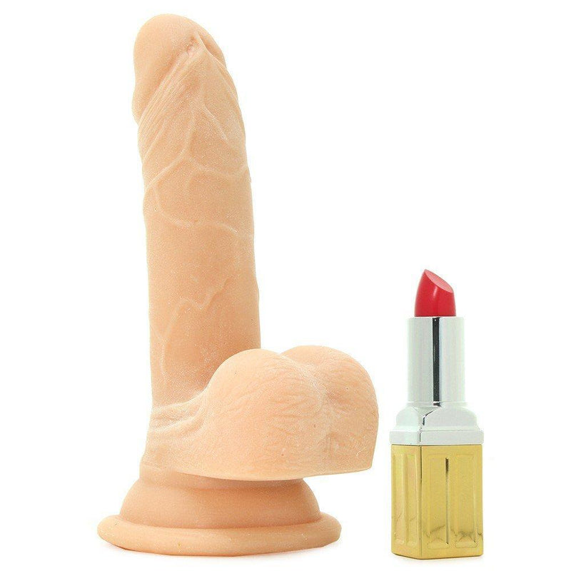 6 and a half inch dildo shown standing up next to lip stick tube for size comparison