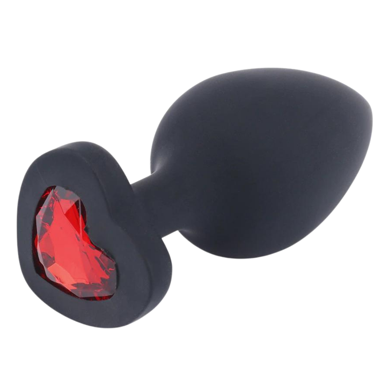 Image of the black butt plug from the side, showing the red heart jewel.