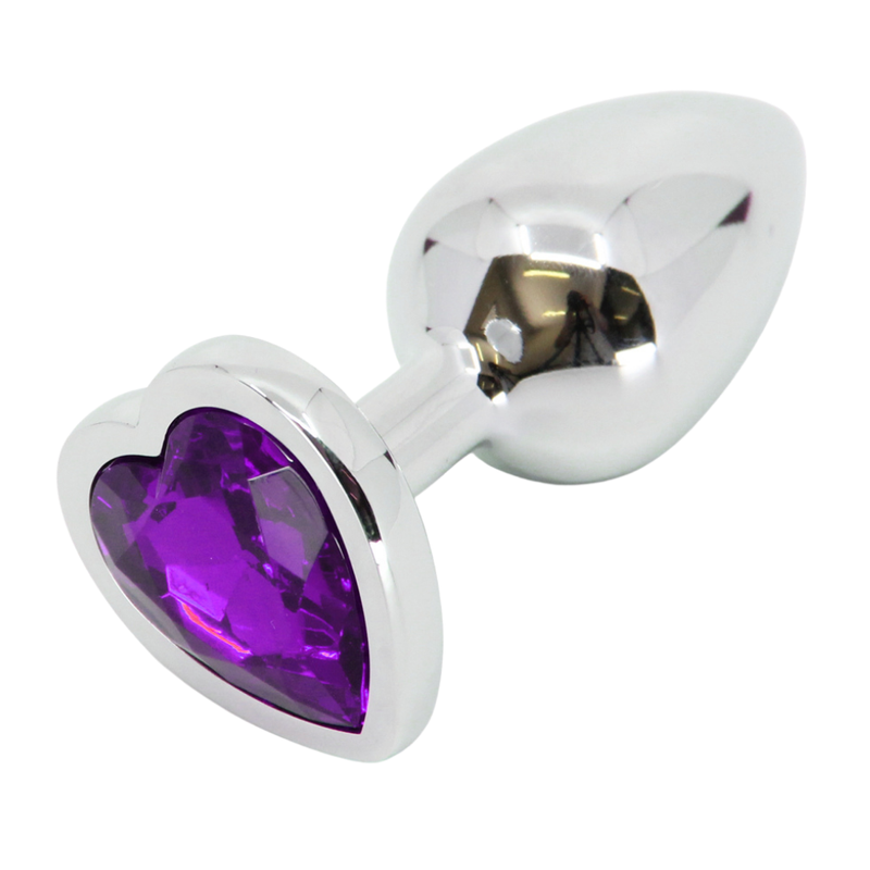 Image of butt plug laying on its side, showing the purple heart jewel on the bottom.