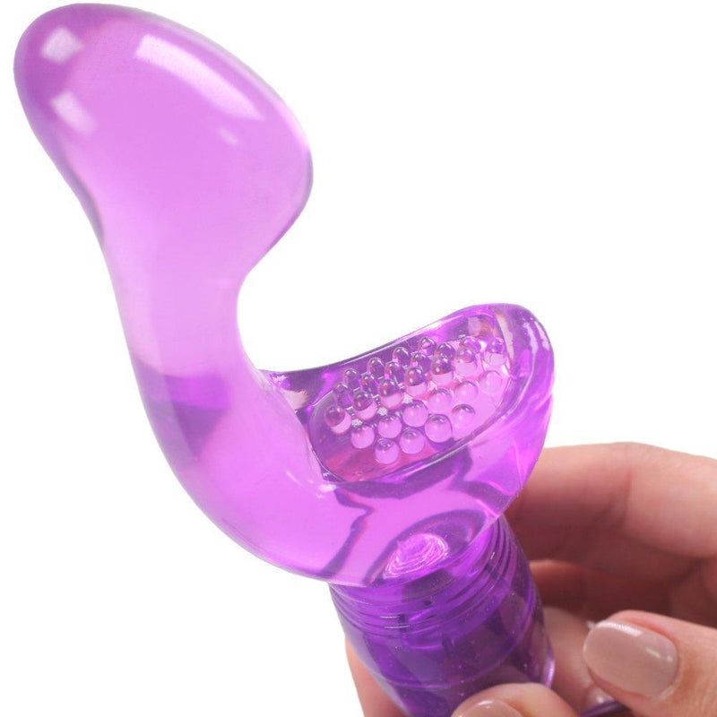 Purple vibrator held in hand