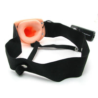 Hollow dildo shown with sex harness and remote control