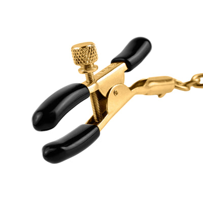 Close up image of the Fetish Fantasy Gold Chain Nipple Clamps showing the black rubber coated tips that give you a more comfortable pinch.
