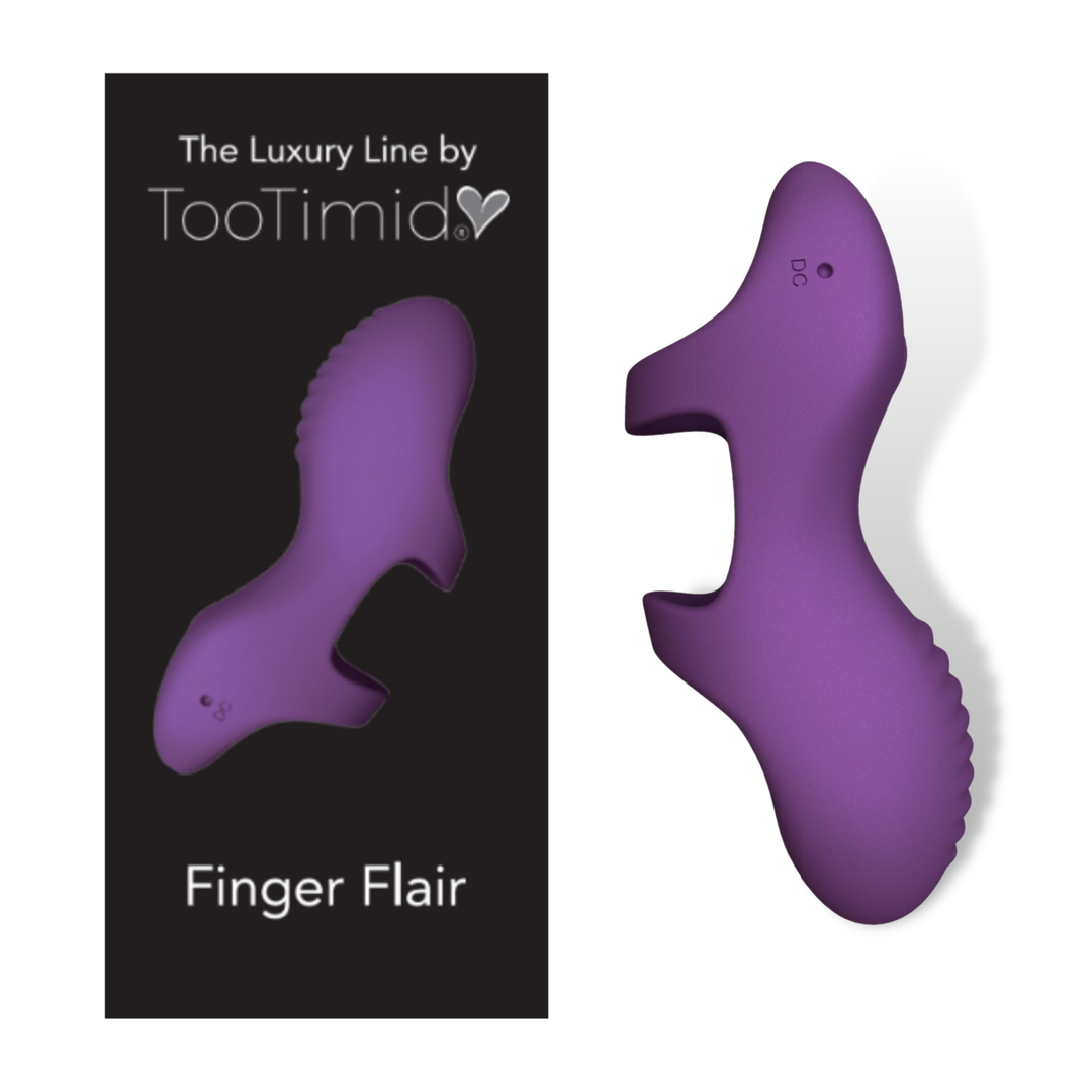 Image of the finger vibrator next to its product packaging.