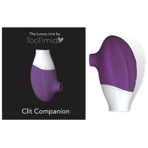 Product of the clit stimulator next to its packaging.