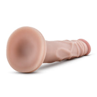 Close up image of suction cup base and realistic veins on this lifelike dildo